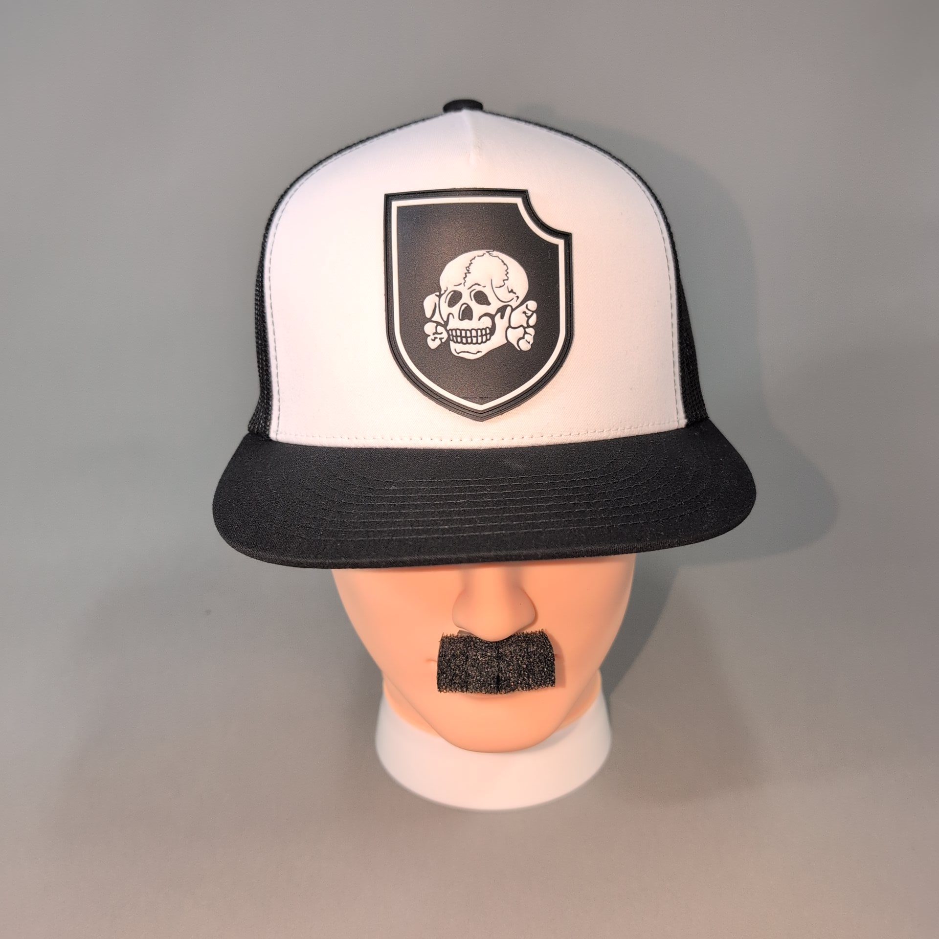 Totenkopf Insignia • PVC Patch • White / Black Flat Bill Trucker Cap